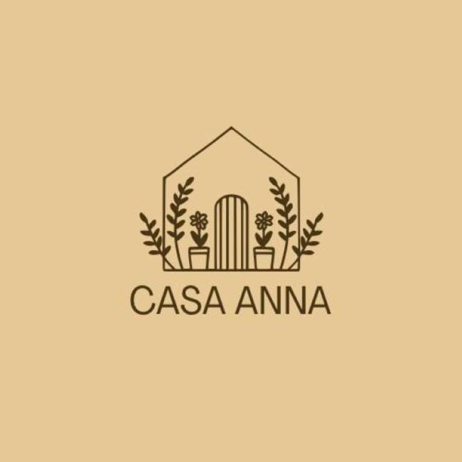 a logo for a casa amina with a house and plants at Casa Anna - Paderno-H SanCarlo-Rho Fiera-Niguarda in Paderno Dugnano