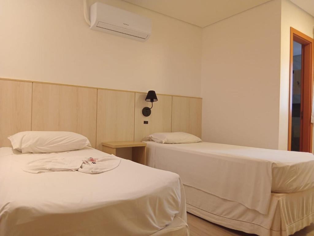 Postel nebo postele na pokoji v ubytování Hotel Turella
