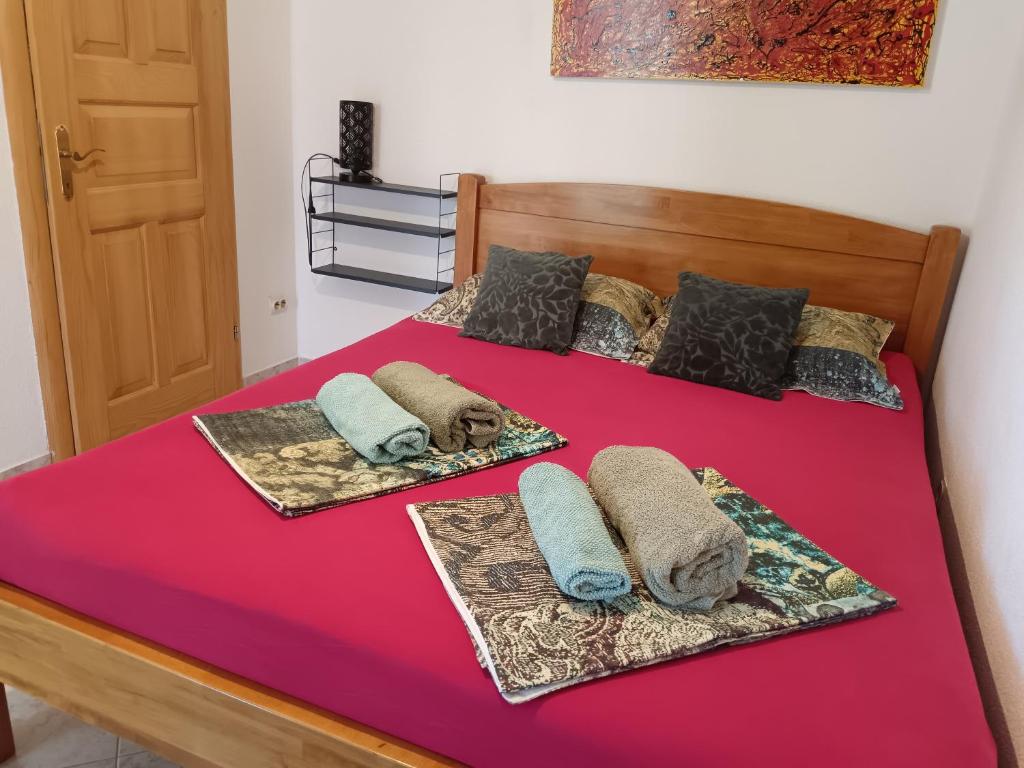 Postel nebo postele na pokoji v ubytování Apartments Moreta