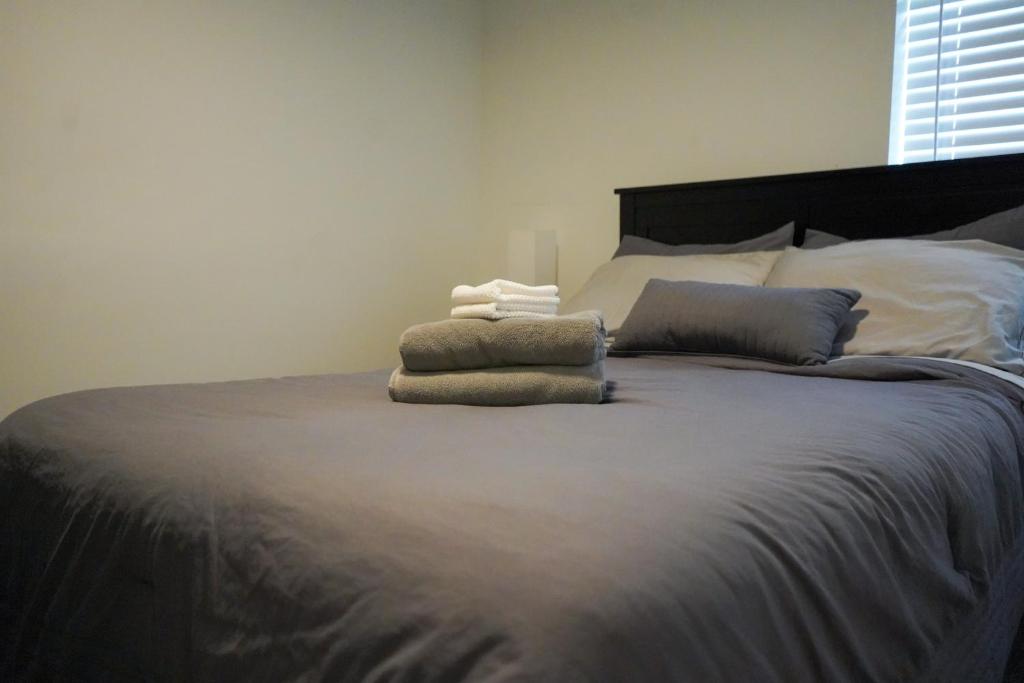 a bedroom with a large bed with two pillows on it at Buckeye Lake Getaway in Thornville