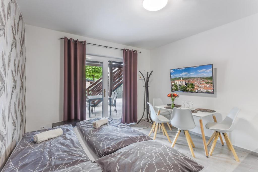 Postel nebo postele na pokoji v ubytování Apartmány pod Pálavou