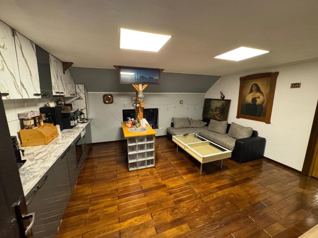 a living room with a couch and a table at Lola's Apartment in Arad