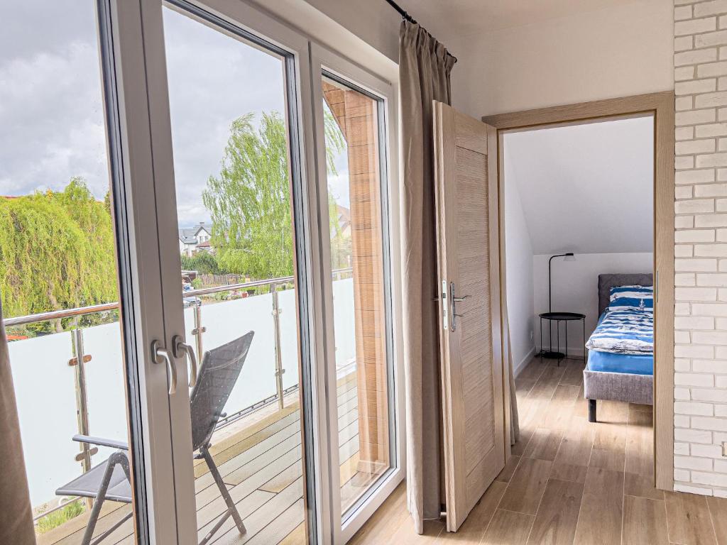 Ένα ή περισσότερα κρεβάτια σε δωμάτιο στο Apartamenty i pokoje nadmorskie - Owocowe Wzgórze