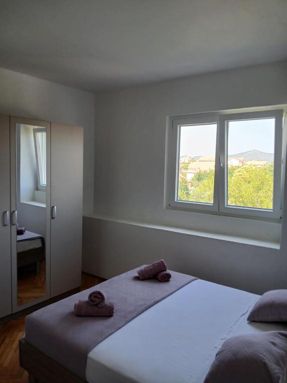 Postel nebo postele na pokoji v ubytování Apartman Maja
