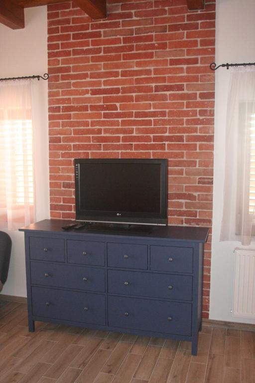 TV a/nebo společenská místnost v ubytování Malomkő Apartman