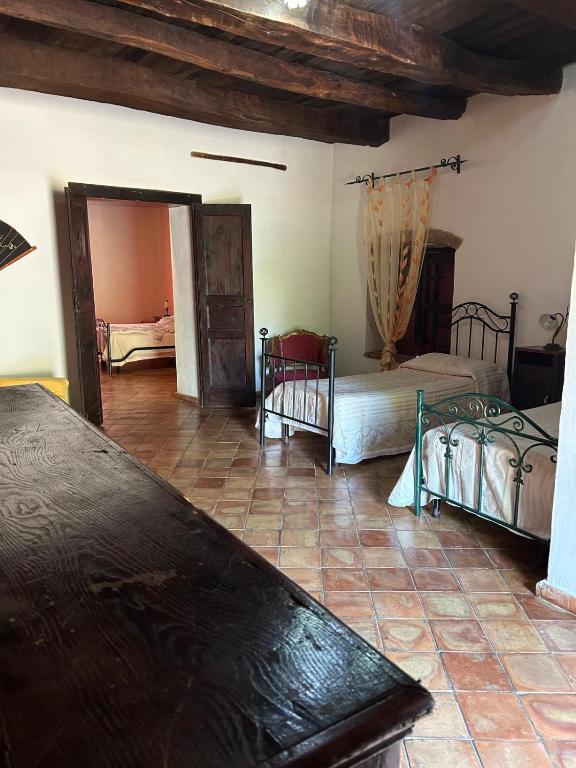 Postel nebo postele na pokoji v ubytování Agriturismo L'Antico Casale