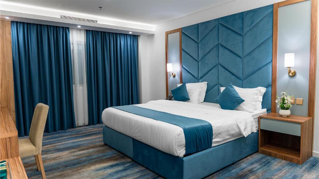 Postel nebo postele na pokoji v ubytování ALHYAT Hotel - فندق الحياة