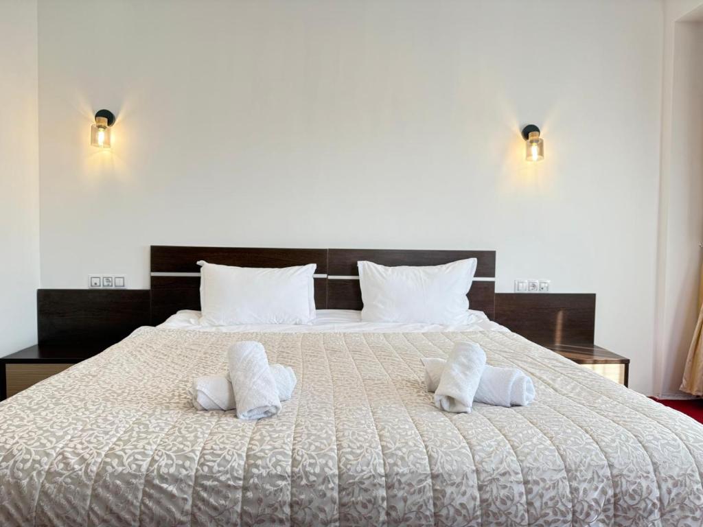 Postel nebo postele na pokoji v ubytování Hotel Q Art Severus