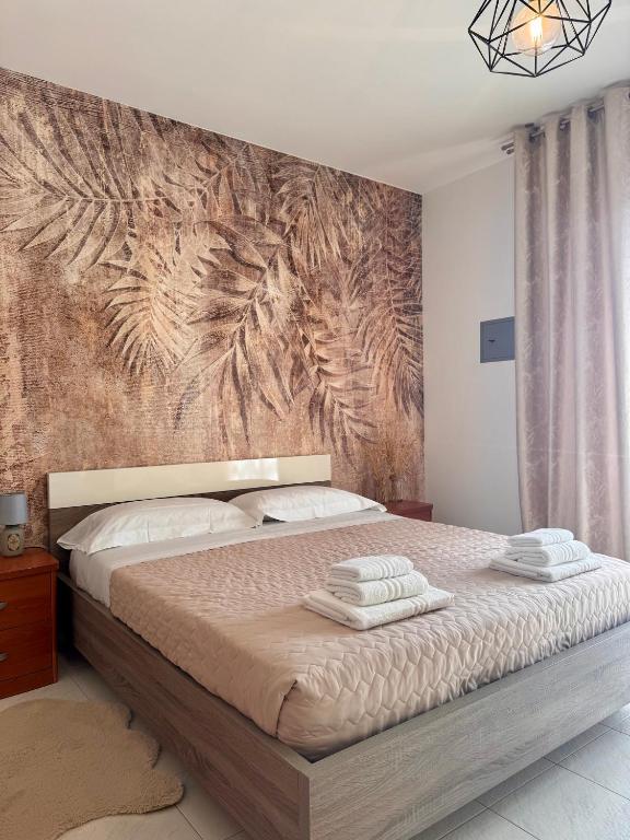 Postel nebo postele na pokoji v ubytování Garda Lake Holiday Apartments quadrilocale
