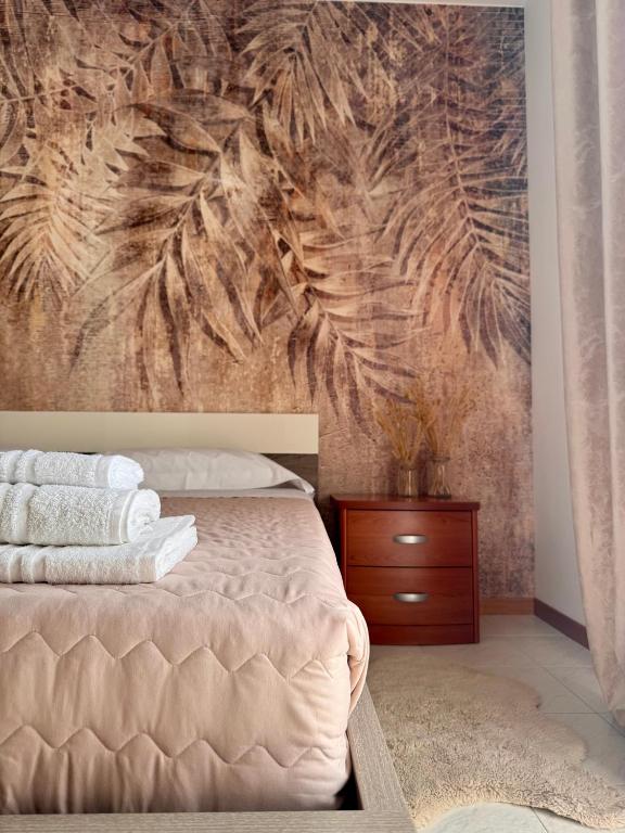Postel nebo postele na pokoji v ubytování Garda Lake Holiday Apartments quadrilocale