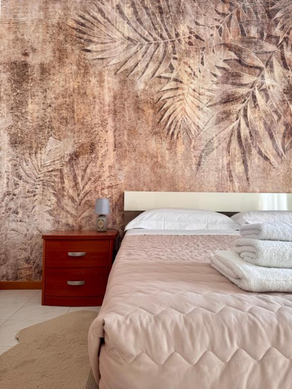 Postel nebo postele na pokoji v ubytování Garda Lake Holiday Apartments quadrilocale