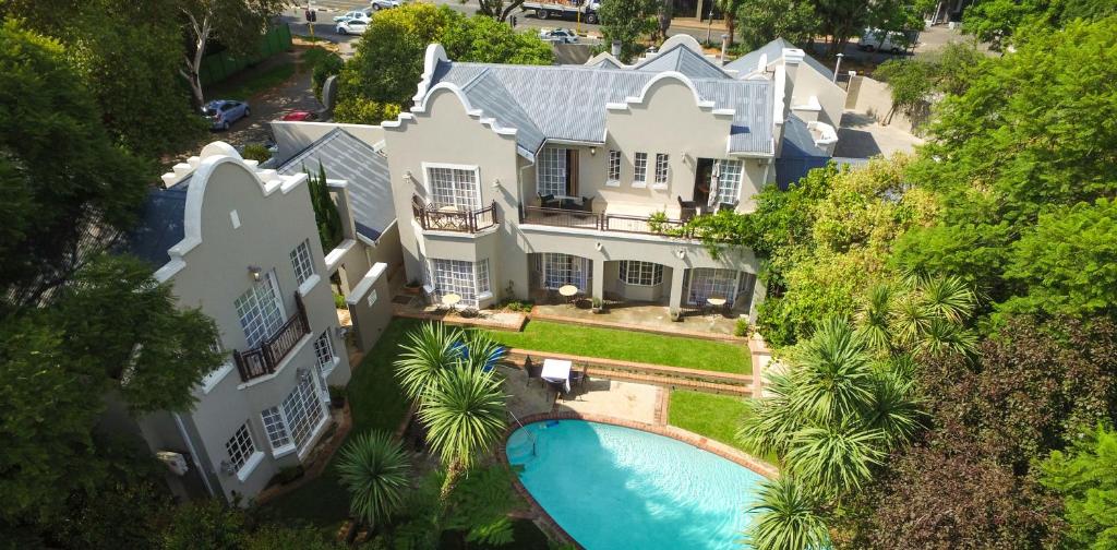 an aerial view of a large house with a swimming pool at Clico Boutique Hotel in Johannesburg