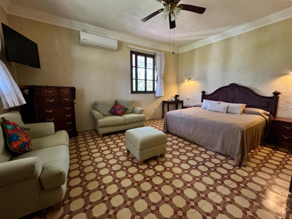 Postel nebo postele na pokoji v ubytování Finca Garullo Hotel Boutique