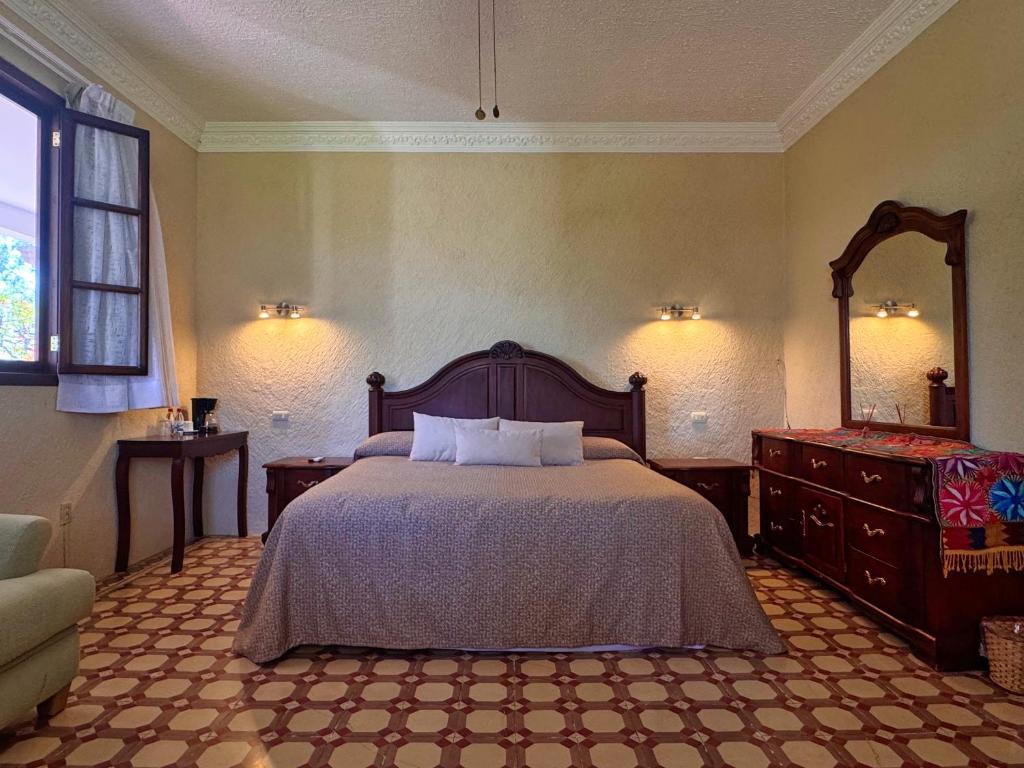 Postel nebo postele na pokoji v ubytování Finca Garullo Hotel Boutique
