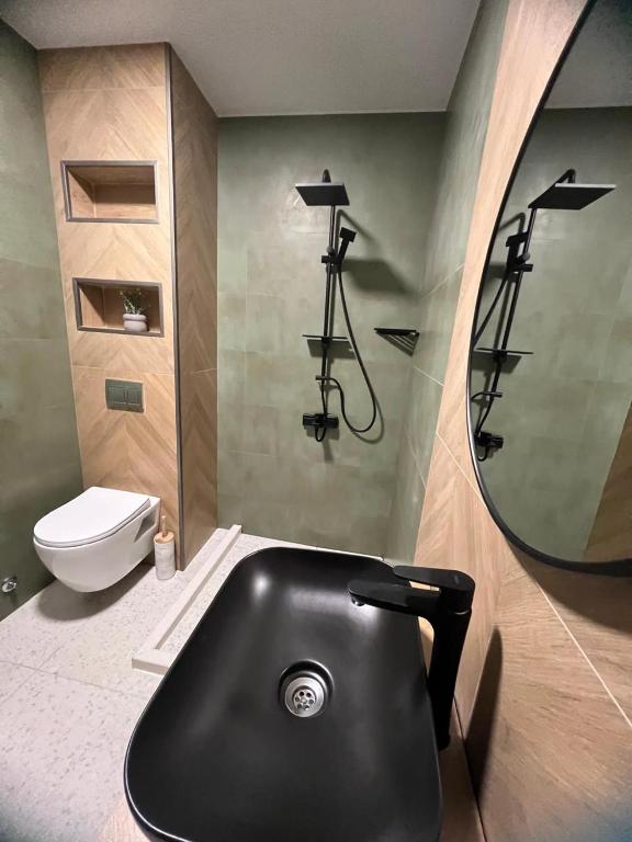 Koupelna v ubytování Villa Deluxe Kvariati