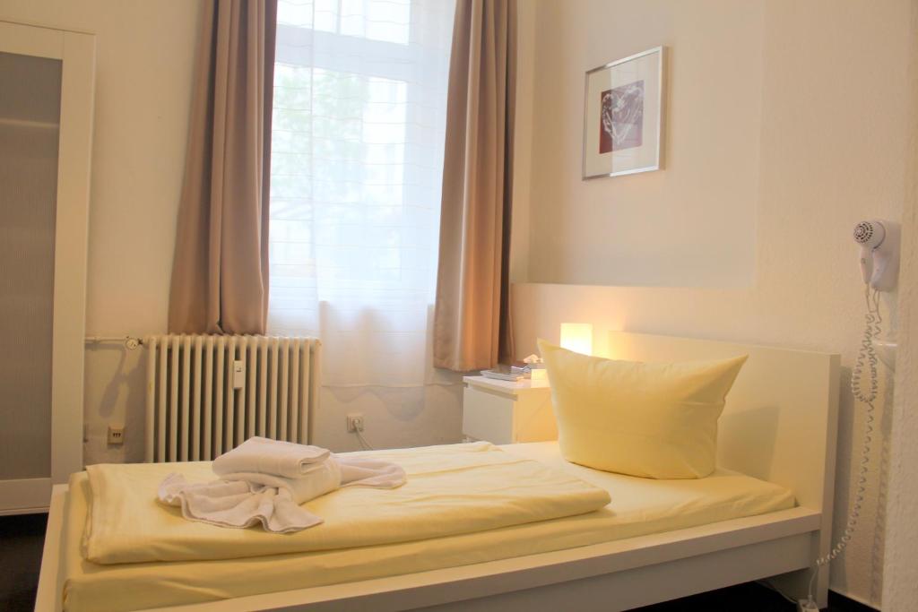 Postel nebo postele na pokoji v ubytování Pension Central Hostel Berlin
