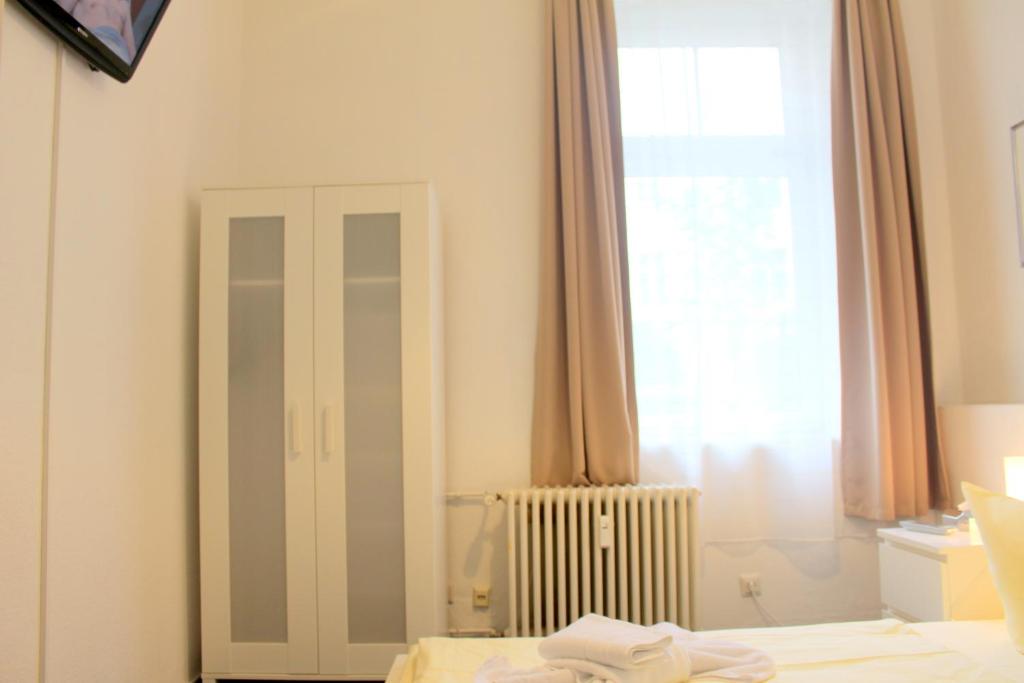 Postel nebo postele na pokoji v ubytování Pension Central Hostel Berlin