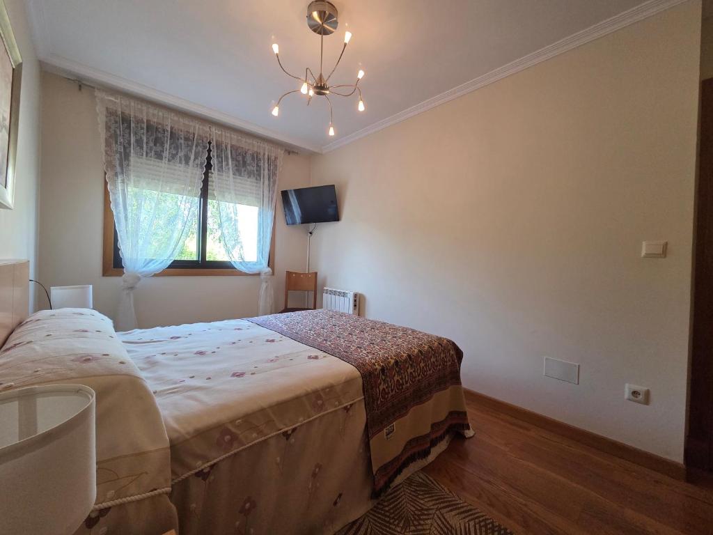 Ένα ή περισσότερα κρεβάτια σε δωμάτιο στο Apartamento Sanxenxo playa