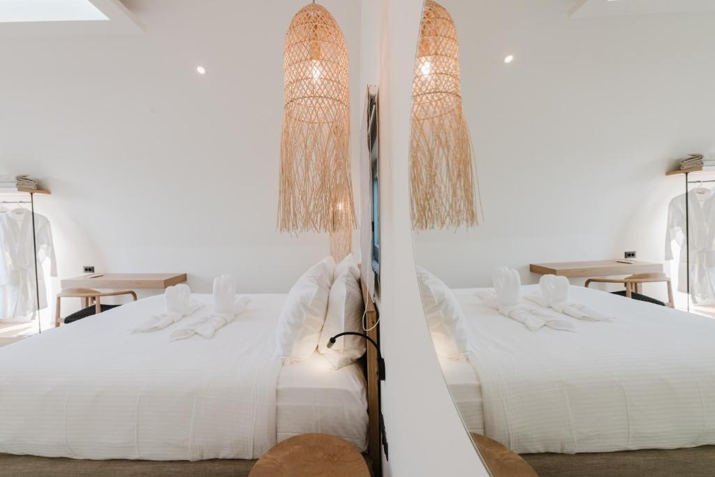 Postel nebo postele na pokoji v ubytování Evexia boutique hotel & Spa