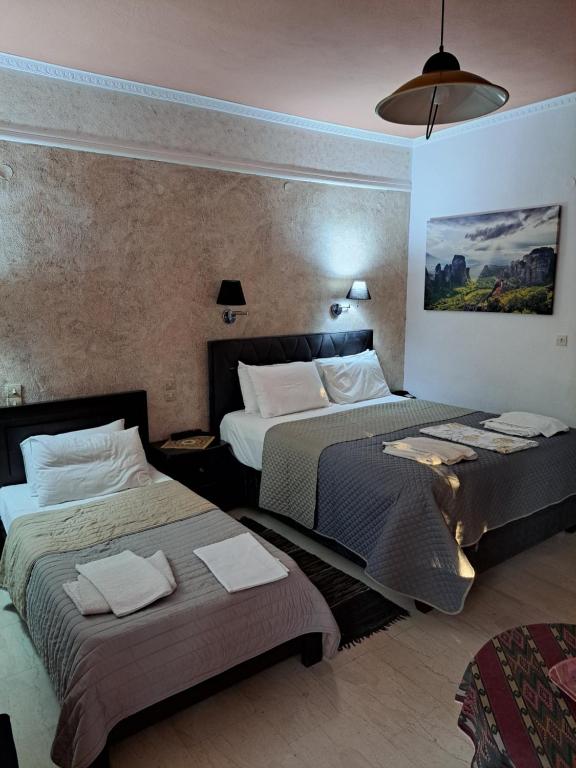 Postel nebo postele na pokoji v ubytování Zozas Rooms