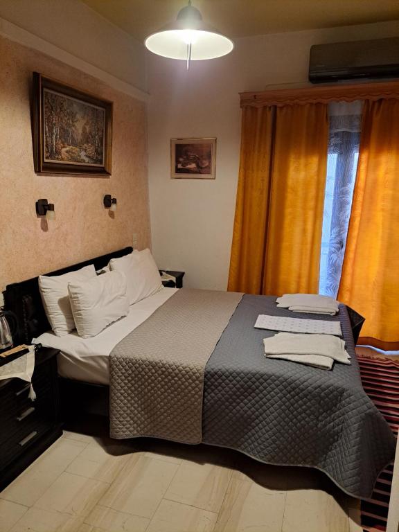 Postel nebo postele na pokoji v ubytování Zozas Rooms