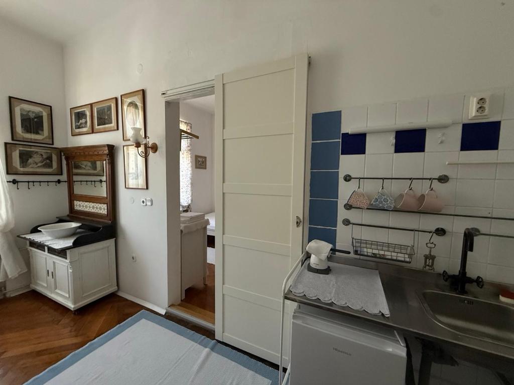 Kuchnia lub aneks kuchenny w obiekcie Guest House Ilicki Plac