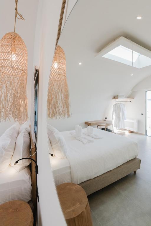 Postel nebo postele na pokoji v ubytování Evexia boutique hotel & Spa
