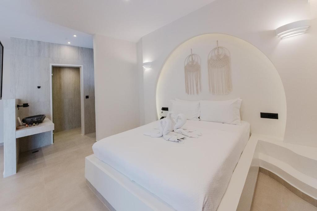 Postel nebo postele na pokoji v ubytování Evexia boutique hotel & Spa