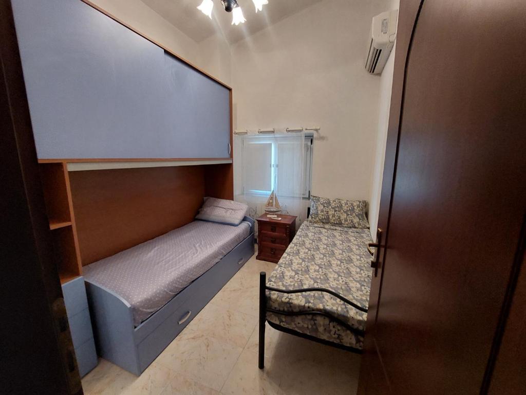 Postel nebo postele na pokoji v ubytování Olbia SARDEGNA- Casa Arena- 3 camere da letto