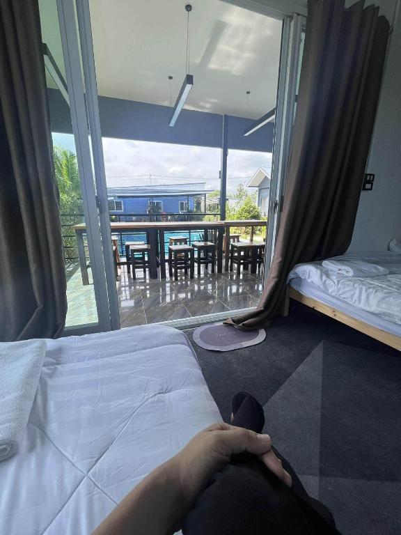 Postel nebo postele na pokoji v ubytování ฟ้ารีสอร์ต FAH Resort