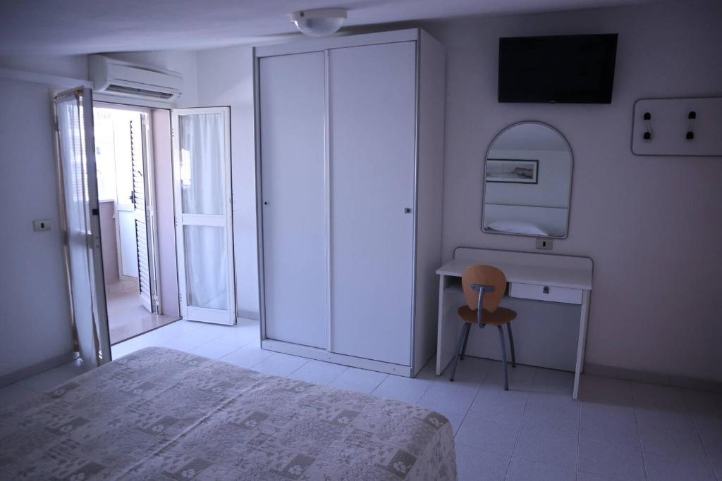 Postel nebo postele na pokoji v ubytování Hotel Astor