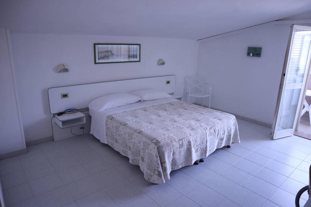 Postel nebo postele na pokoji v ubytování Hotel Astor