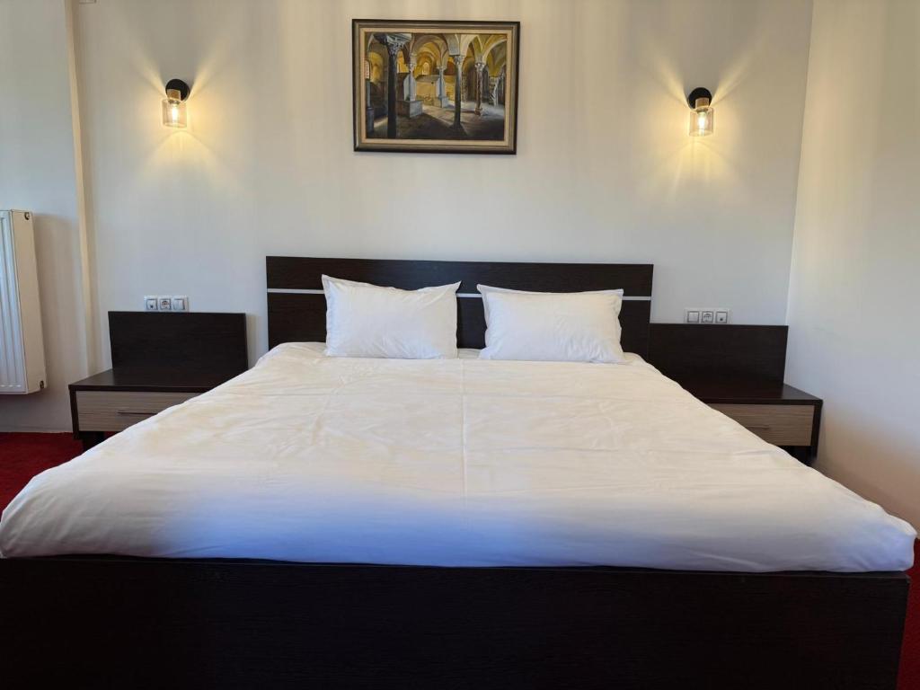 Postel nebo postele na pokoji v ubytování Hotel Q Art Severus