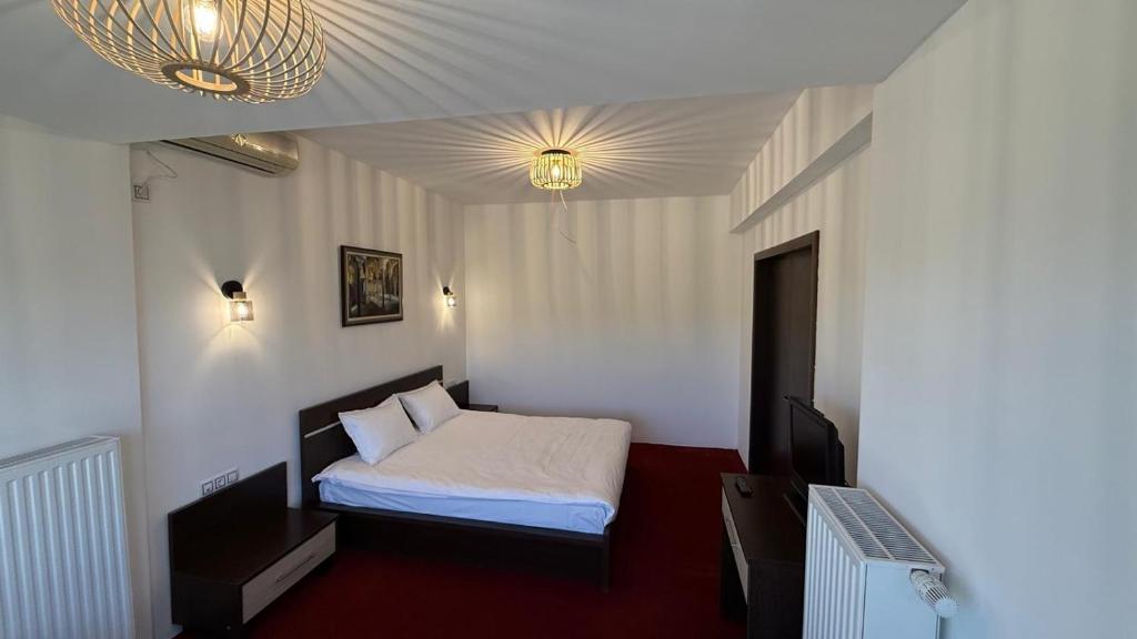 Postel nebo postele na pokoji v ubytování Hotel Q Art Severus