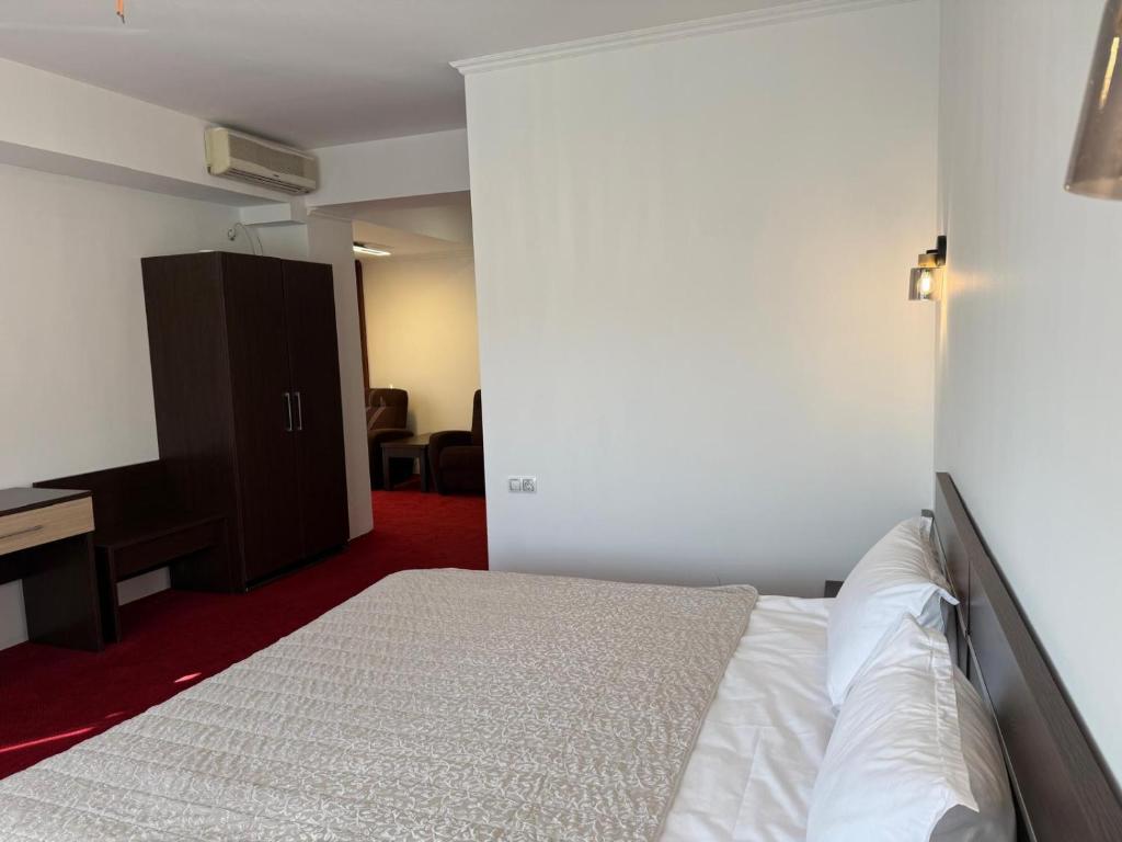 Postel nebo postele na pokoji v ubytování Hotel Q Art Severus
