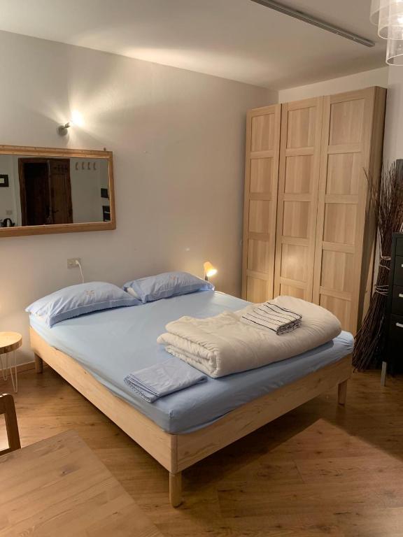 Postel nebo postele na pokoji v ubytování Piccolo Rifugio di Foppolo