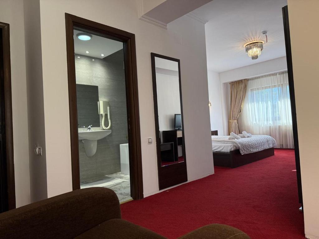 Postel nebo postele na pokoji v ubytování Hotel Q Art Severus