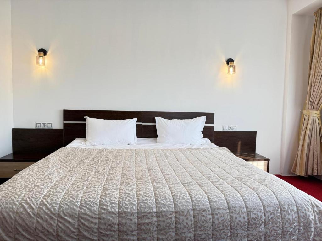 Postel nebo postele na pokoji v ubytování Hotel Q Art Severus