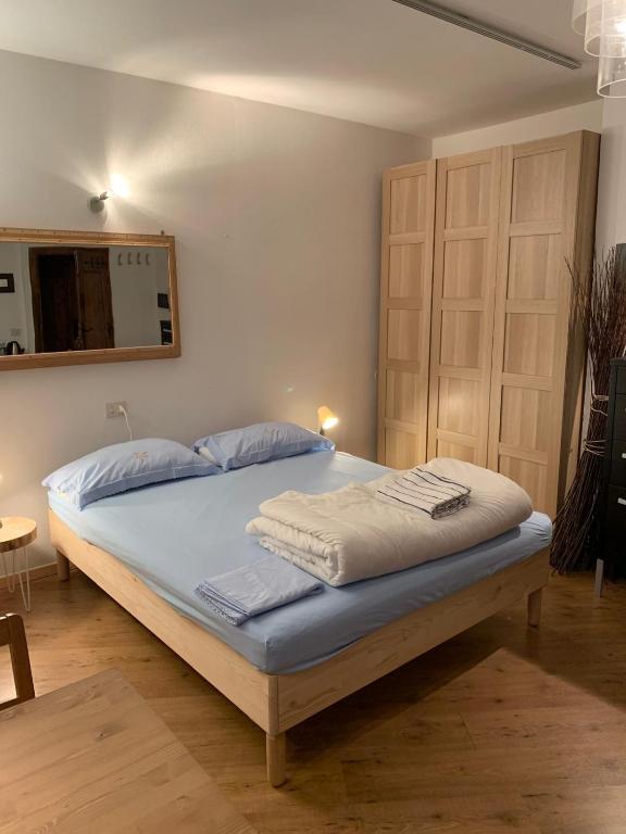 Postel nebo postele na pokoji v ubytování Piccolo Rifugio di Foppolo