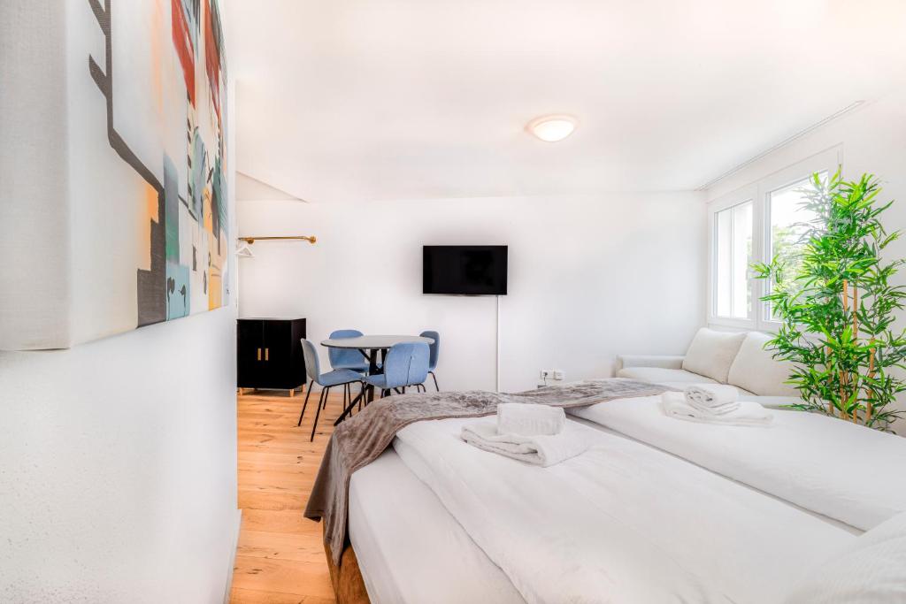 Postel nebo postele na pokoji v ubytování EH Apartments Urban