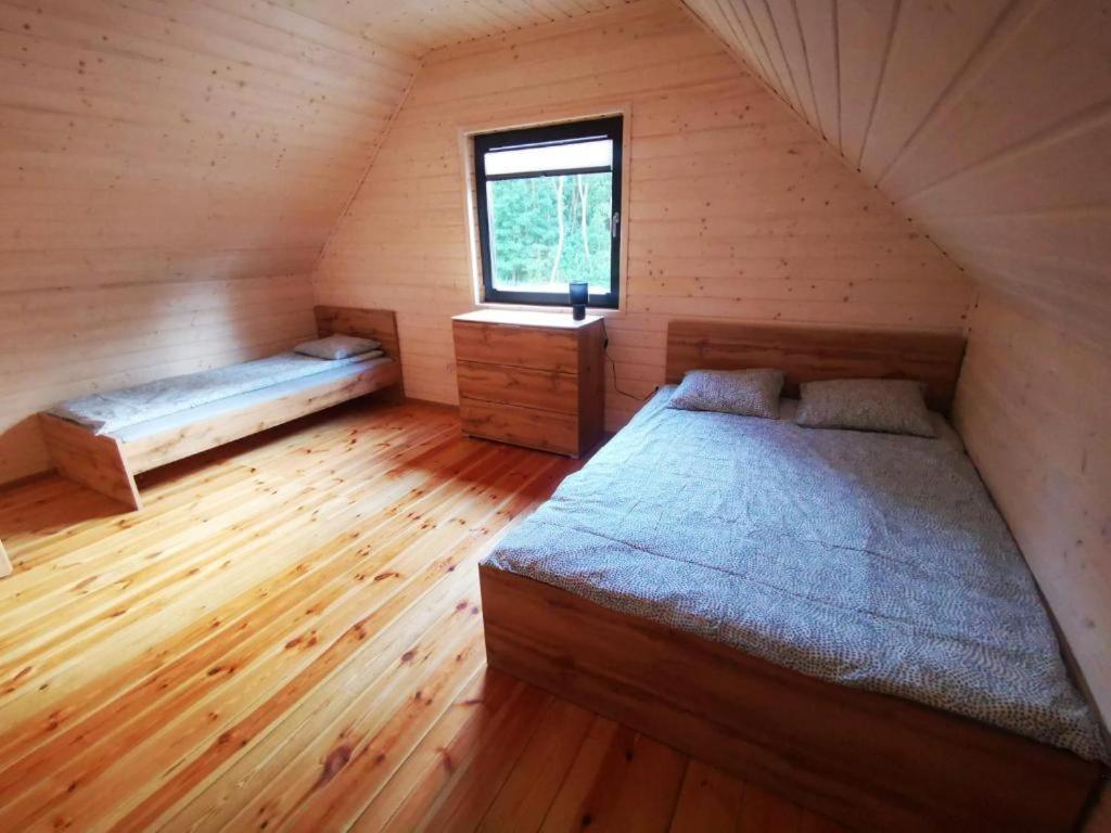Postel nebo postele na pokoji v ubytování Domki AGA