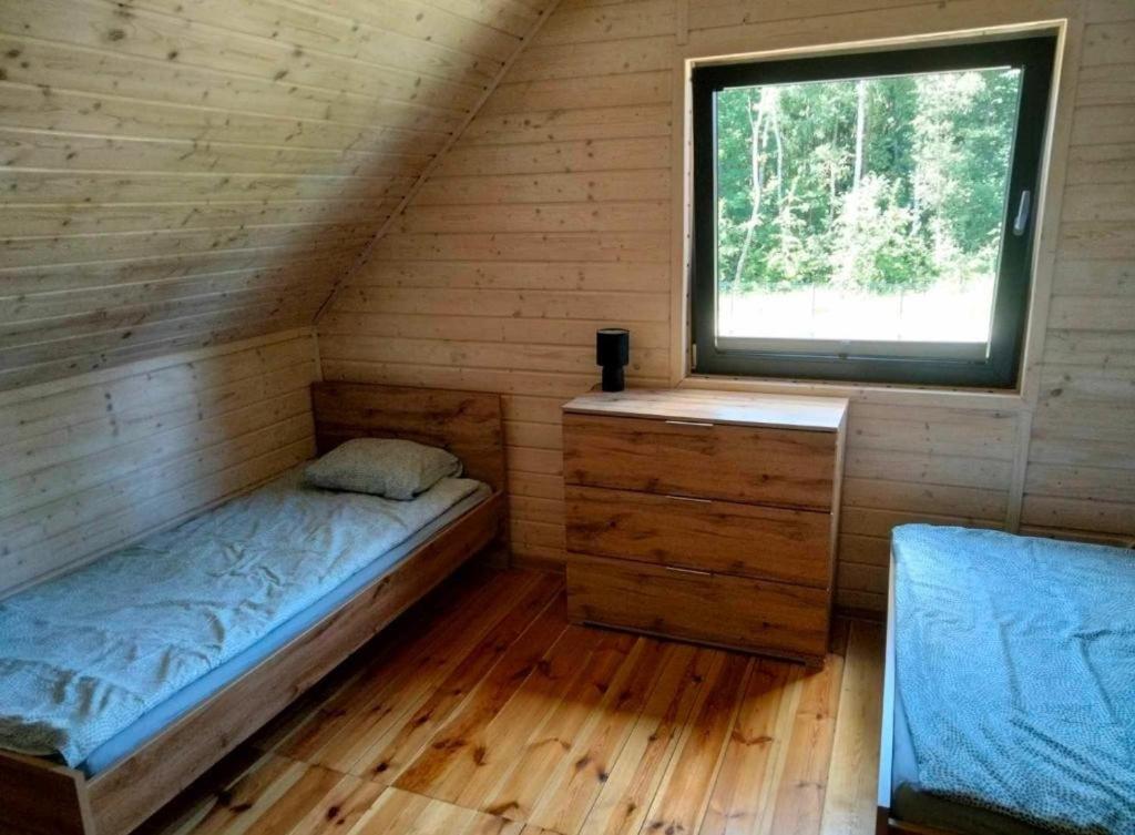 Postel nebo postele na pokoji v ubytování Domki AGA