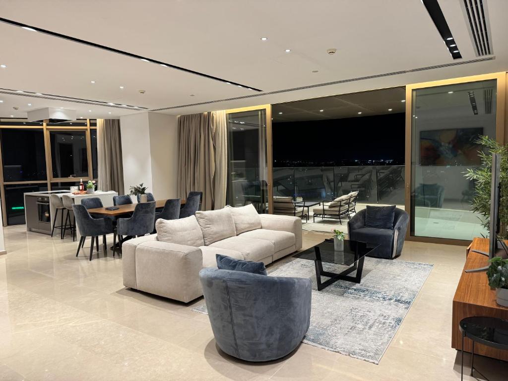 a living room with a couch and chairs and a table at WealthyStays 360 Luxury Residence in Nicosia