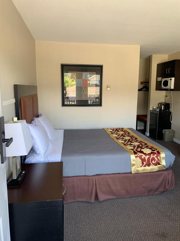 Postel nebo postele na pokoji v ubytování Rondo Motel