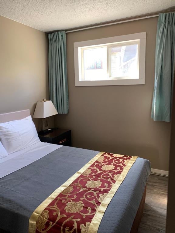 Postel nebo postele na pokoji v ubytování Rondo Motel