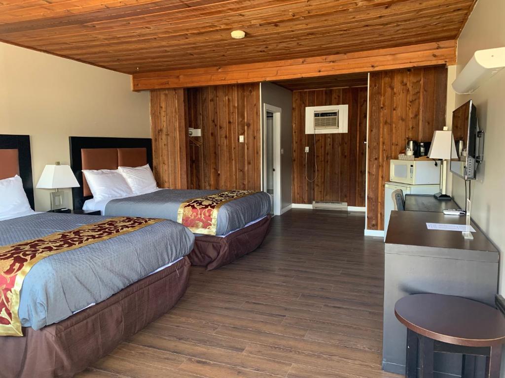 Postel nebo postele na pokoji v ubytování Rondo Motel