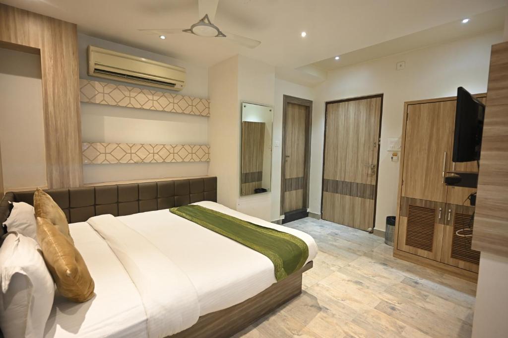 Postel nebo postele na pokoji v ubytování Hotel Saffron