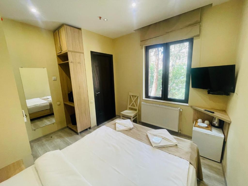 Postel nebo postele na pokoji v ubytování Hotel Brick House