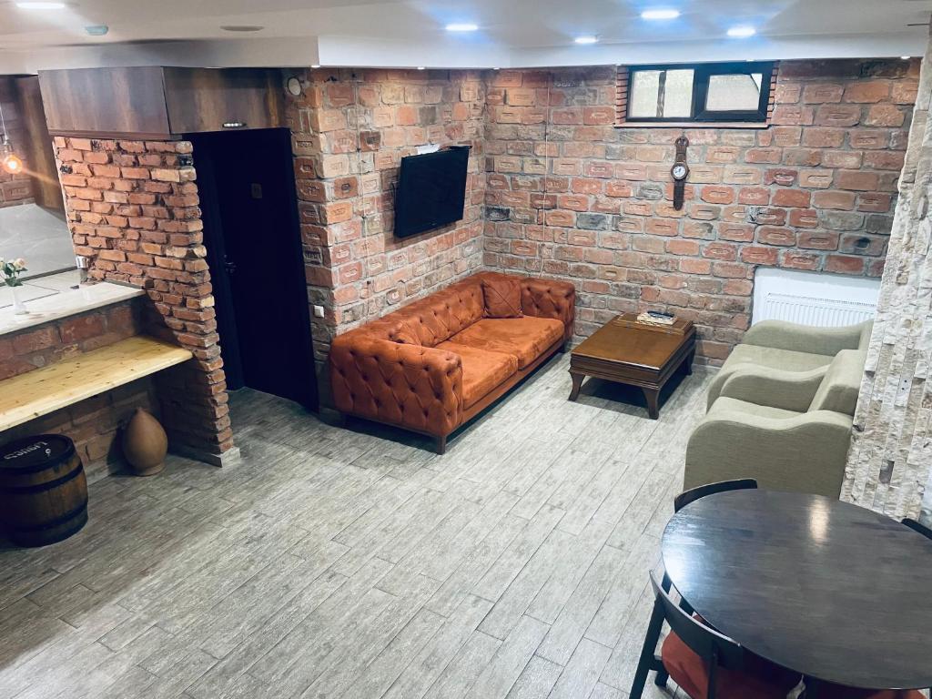 TV a/nebo společenská místnost v ubytování Hotel Brick House