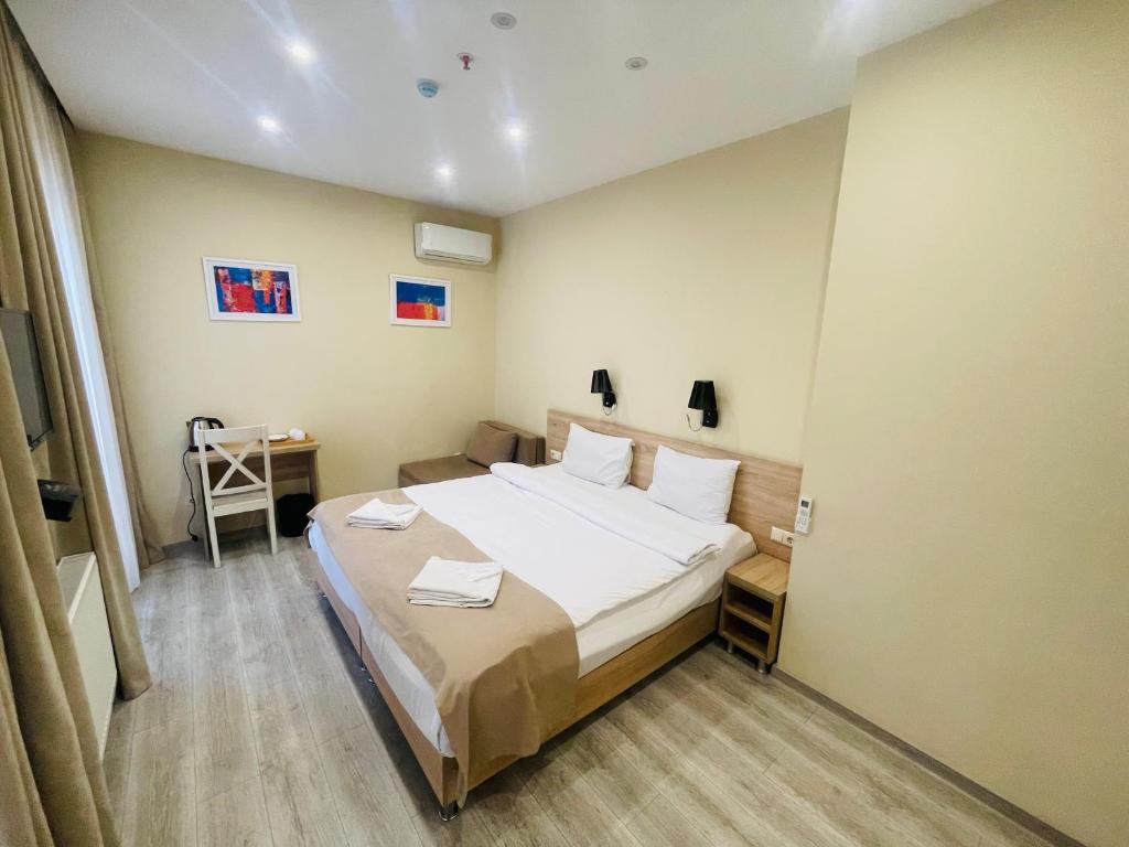 Postel nebo postele na pokoji v ubytování Hotel Brick House